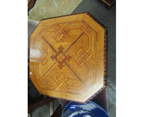 A 19th Century oak marquetry top gypsy table with canted corners, bobbin tripod support