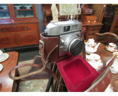 A Balda 35mm camera together with brown leather case and tripod