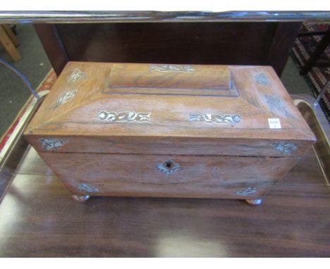 A Victorian rosewood sarcophagus form tea caddy with mother of pearl inlay, fitted interior, foot missing 