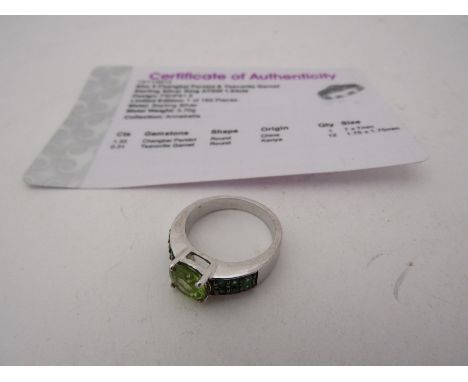 A Chengbai peridot and tsavorite garnet ring, stamped 925, size J. 3.9g with certificate 