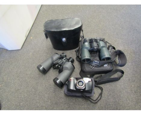 Two modern pairs of binoculars and a camera in a case (3) 
