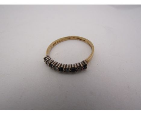 A gold, sapphire and diamond dress ring