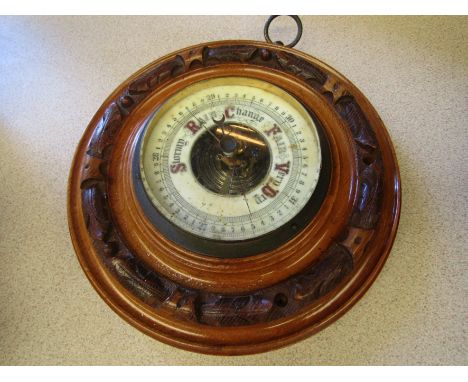 An early 20th Century oak circular barometer 