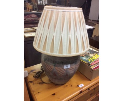 A pottery table lamp and shade