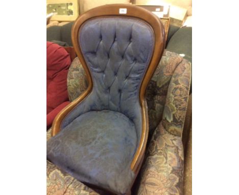 A reproduction mahogany button back nursing chair