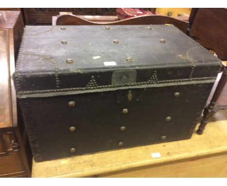 A metal bound trunk containing carved oak mouldings