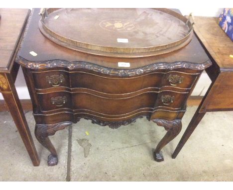 A mahogany Chippendale style two drawer side table raised on claw and ball supports 