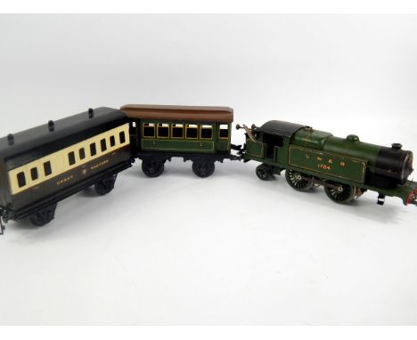 A Hornby clockwork LNER locomotive, with a Bachmann carriage and one unbranded carriage (3).