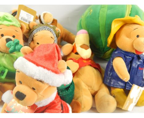 A collection of modern Winnie the Pooh soft toys, in various costumes, Disney Store, Mattel and other makes (a large collecti