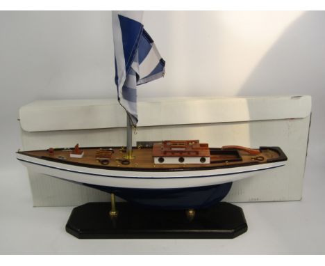 A Leonardo Collection ornamental scale model yacht, with decorative materials, sail and wooden decking, boxed.