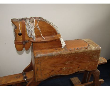 A child's pine rocking horse, 91cm long.