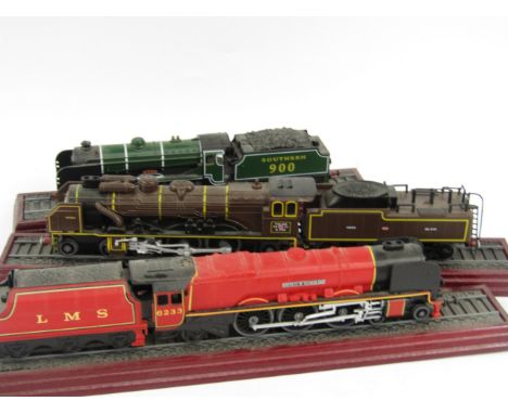 A Bachmann British Rail engine, 2-4-2, black livery, two carriages, a model of Stephenson's Rocket made from coal, five mount
