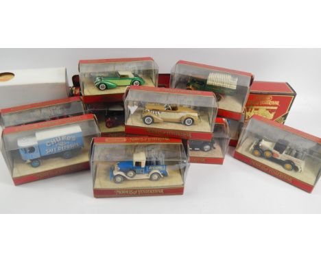 A collection of Matchbox die cast Models of Yesteryear, including classic cars and commercial vehicles and a Fowler Showmans 