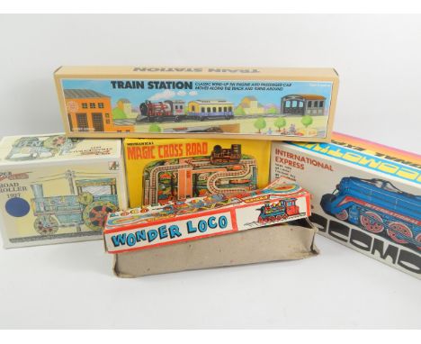 Various tin plate clockwork train sets, to include a Magic Crossroad set, a limited edition Schylling train station and three