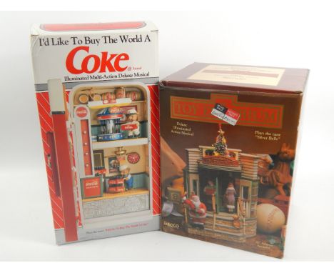 Two Enesco musical toys, to include a Coke related one playing I'd Like To Buy The World a Coke and a toy emporium playing th