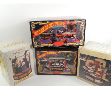 Two Enesco Railway Romance Deluxe action musical raliway items, comprising an engine playing Casey Jones and a carriage playi
