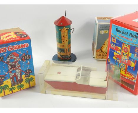 A collection of modern tin plate toys, including merry-go-rounds, (1 box).