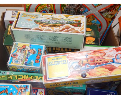 Tin plate toys and other games, including a Chinese friction helicopter, three wind up ice cream vendors, a Schylling collect