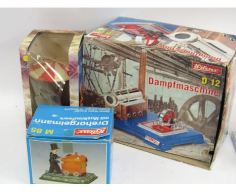 Wilesco Toys, a steam engine, Damfmaschine D12, barrel organ grinder M85, and a roundabout, all boxed, (3).