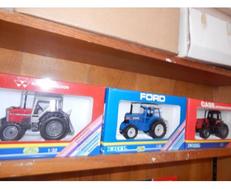 Six Ertl tractors, 1:32 scale, and including Massey Ferguson, Ford, Case and John Deere, all in original packaging.