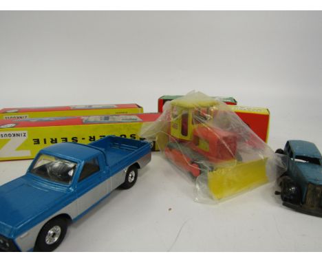 Four die cast Siku vehicles; VW camper, tractor and two cars with caravans, boxed and sundry unboxed vehicles, (quantity).