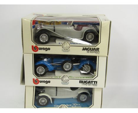 Three Burago scale car models; Jaguar 55100 (1937), Bugatti type 59 (1934), and Mercedes Benz SSKL (1931), all boxed.