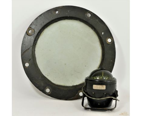 A Danforth Corsair ships compass, 11cm, with mounting bracket, serial number H91323, together with a brass porthole, 35cm (2)