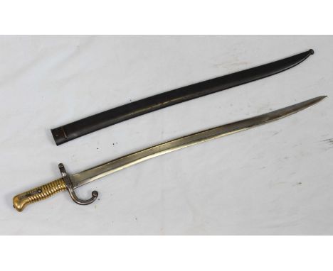 A French 1868 pattern Chassepot bayonet, 22.5-inch yataghan fullered blade with various proof marks, ribbed brass handle and 