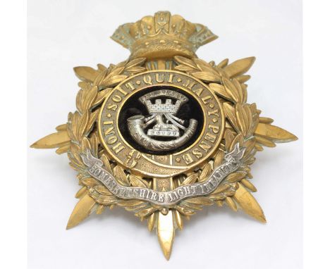 A Somersetshire Light Infantry helmet plate, crowned star and garter with laurel wreath, Jellalabad, Sphynx and Bugle horn to