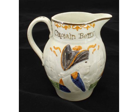 An early 19th Century Prattware ceramic jug, with relief moulded decoration depicting Admiral Nelson to one side and Captain 