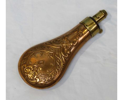 A copper powder flask by G. & J.W. Hawksley, the copper body embossed both sides with scrollwork and shells brass spring leve