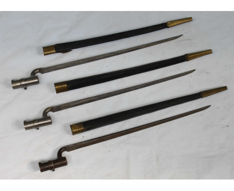 Three British 1853 Pattern Enfield Socket bayonets, each with triangular-section fullered blade, locking ring and brass-mount