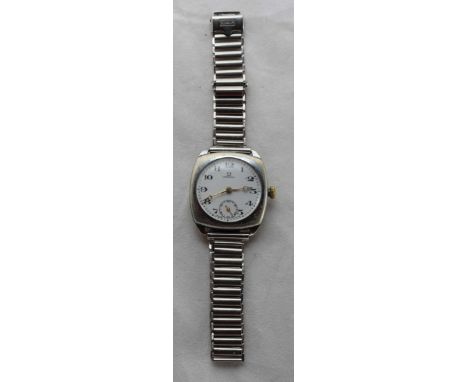A stainless steel cushion cased Omega wristwatch c.1916, the white enamel dial with Roman numerals denoting hours and subsidi