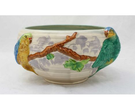 A Clarice Cliff ceramic fruit bowl decorated with Budgerigar's perching on blossoming branches, hand painted, stamped mark to