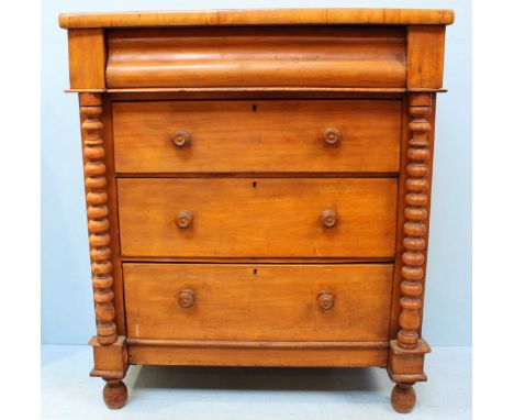 A 19th Century faded walnut chest of four long drawers with turned pulls, bobbin pilasters and raised on turned feet. 107cm w
