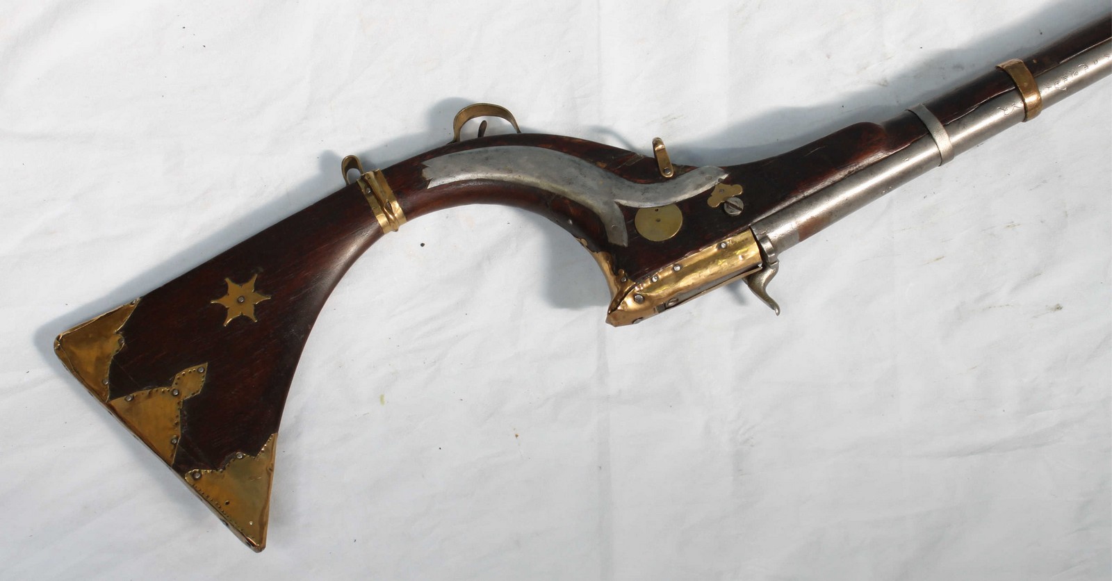 An antique AfghanPersian percussion lock Jezail (camel gun), with 46.5" steel barrel, stainedwo