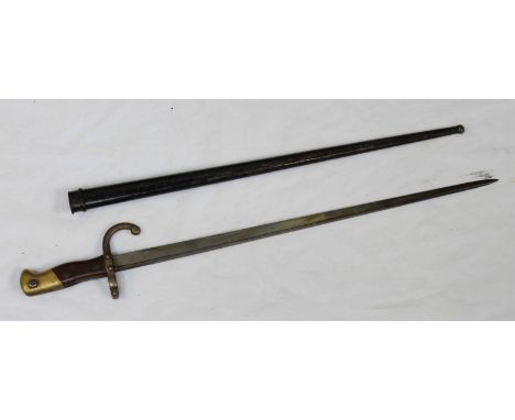 A French 1876 pattern Gras bayonet, 20.5-inch blade, brass-mounted wooden grip, black lacquered metal scabbard