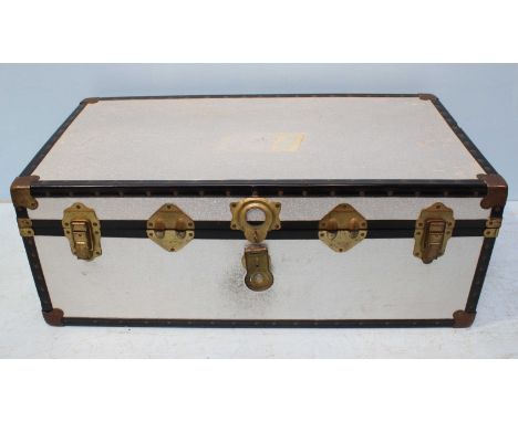 A 20th century metal trunk, the inside lined with a blue and white chequered patterned fabric, 92cm wide