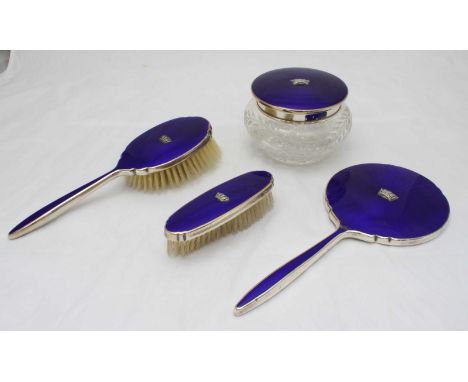 A four piece silver-plate and enamel Admiralty brush set, made by Adie Brothers ltd, comprising two brushes, mirror and powde