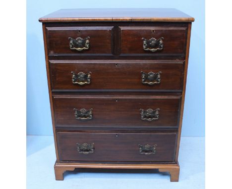 A stained mahogany chest of two short and three long graduated drawers with brass handles and flushed brass escutcheons, rais