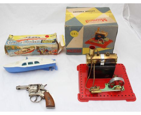 A Mamod S.E.I. stationary steam engine, together with a Welsotoys clockwork powered 'Cabin Cruiser', both boxed, and a starti