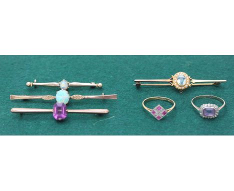 Two opal set 9ct gold bar brooches, an amethyst 9ct gold bar brooch and another aquamarine and seed pearl 9ct gold bar brooch