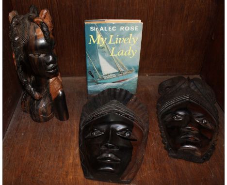 SECTION 39.  A group of three dark wood carvings of African women, together with a signed first edition Alec Rose "My Lively 