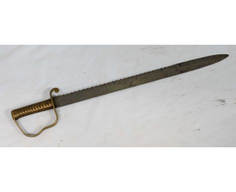 An 1856 pattern British Army Pioneer saw-back sword, with brass grip and knuckle band, serrated edge, numbered markings, 22.5