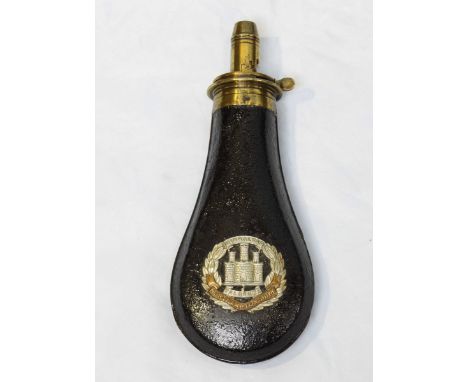 A Dixon's Patent powder flask, with 5-measure dispenser, the black body mounted with a cap badge for Northamptonshire regimen