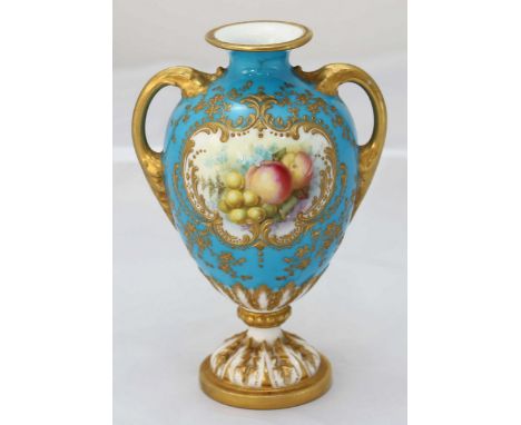 A Royal Worcester twin handled ewer painted by William Hawkins, decorated with fruit on a pale blue ground, raised round gilt