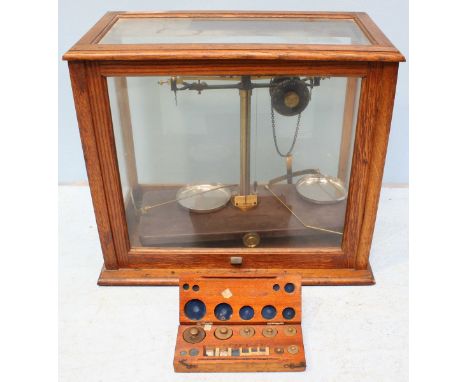 A cased set of Griffin and Tatlock weighing scales, together with a boxed set of weights.