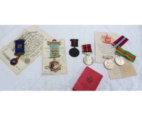 A George V British Empire medal, boxed together with two world war II medals including the Defence medal and War medal, the b