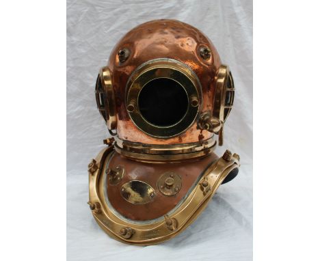 A Siebe Gorman & Co Ltd twelve bolt copper divers helmet, stamped to the underside of the collar and matching on the helmet, 