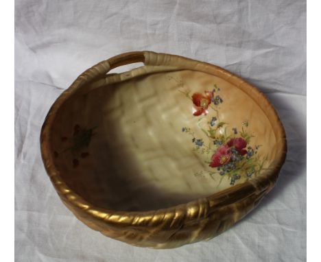 A Royal Worcester porcelain bowl moulded in the form of a basket with twin gilt decorated handles, the interior transfer and 